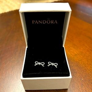 Pandora bow earrings brand new in box, never worn.